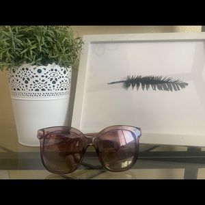 Purple Guess sunglasses.